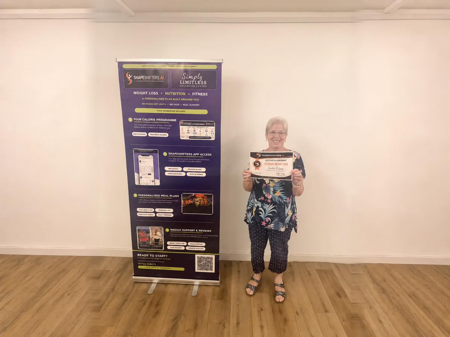 Sandra O’Leary holding her ShapeShifters one-and-a-half-stone weight-loss achievement certificate